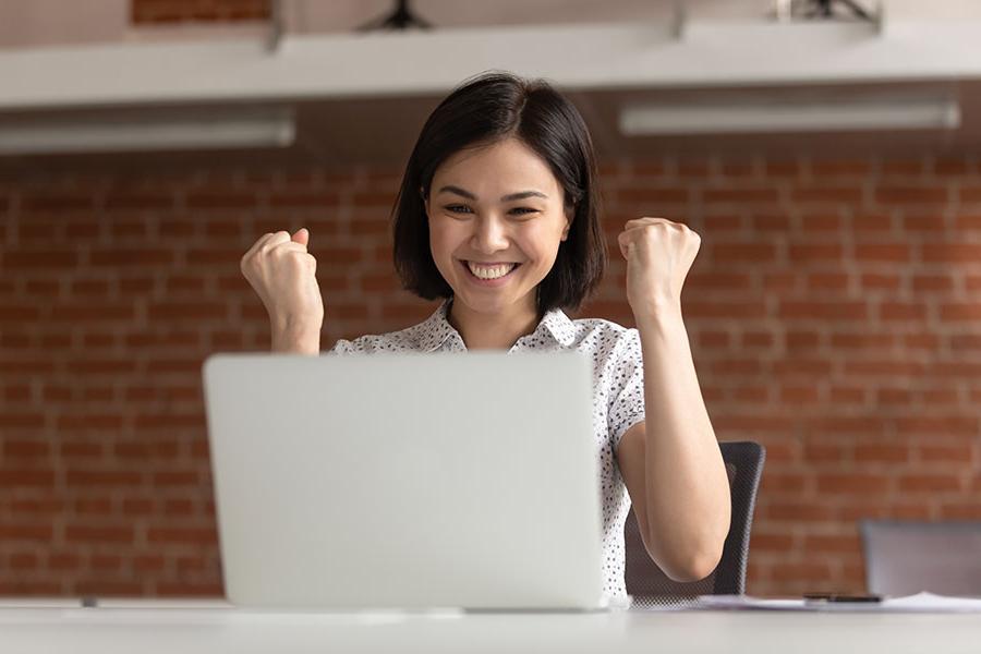 woman-cheering-laptop